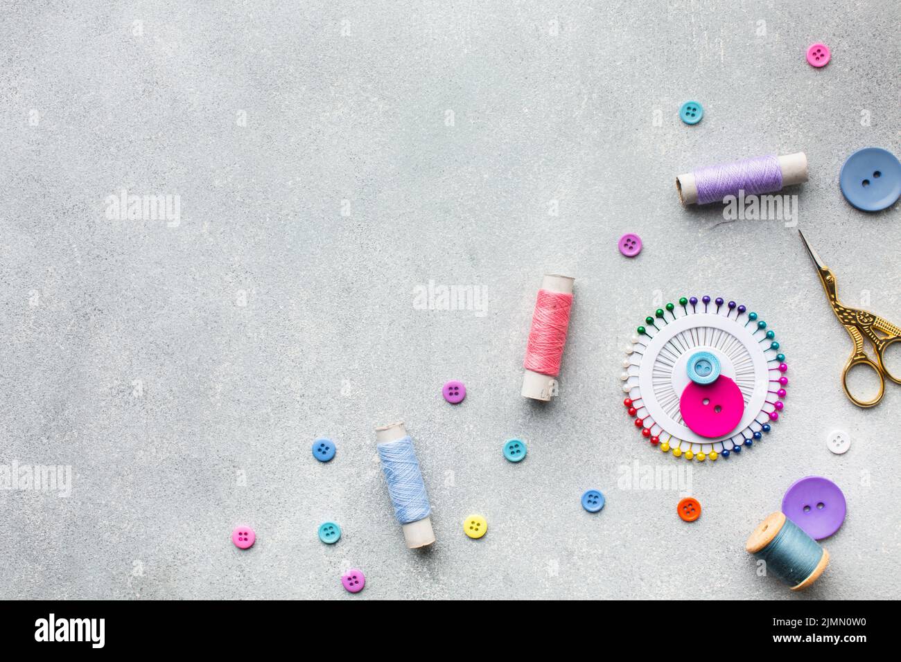 Arrangement colourful sewing threads buttons Stock Photo