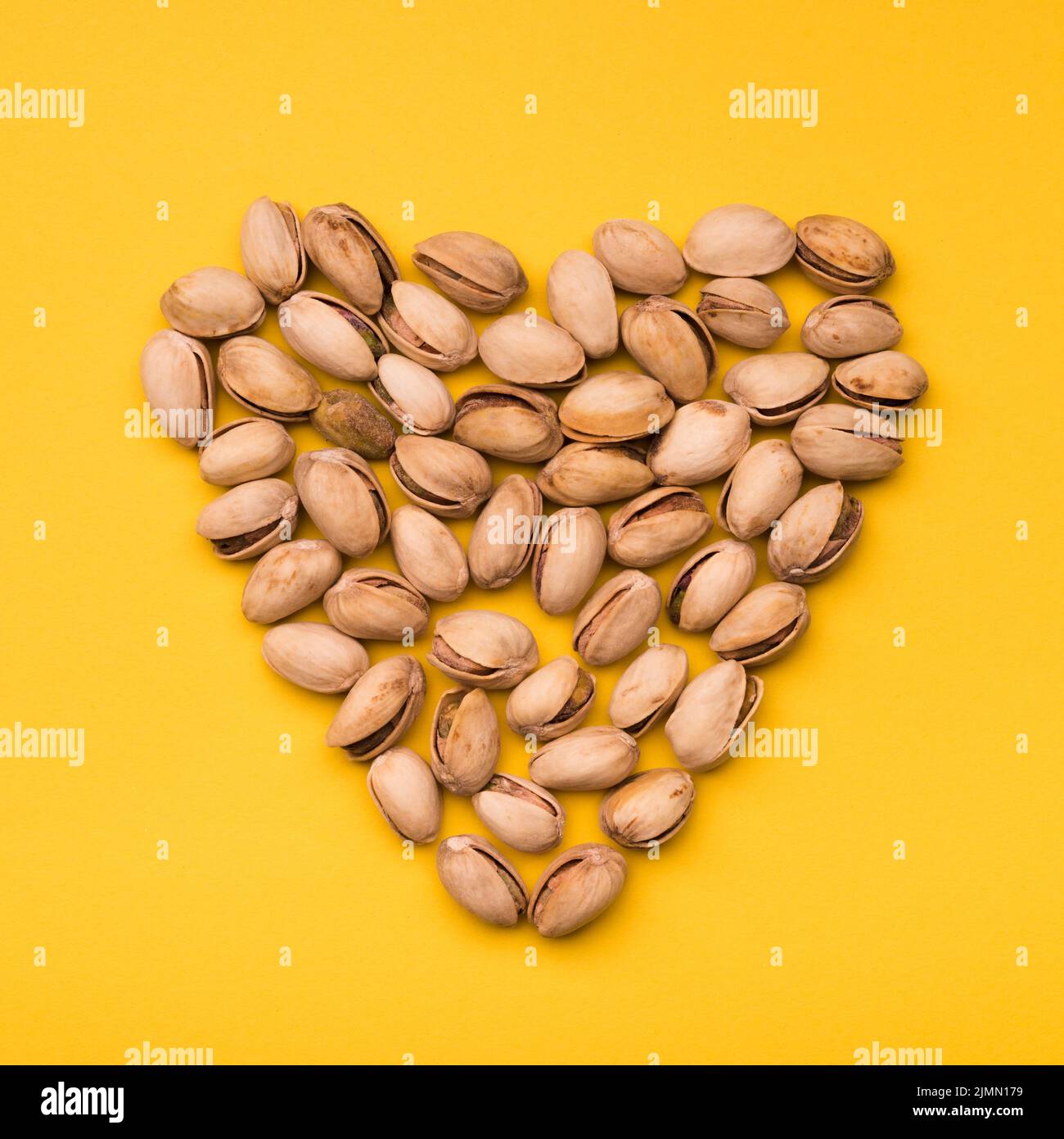 Flat lay pistachio heart shape Stock Photo Alamy