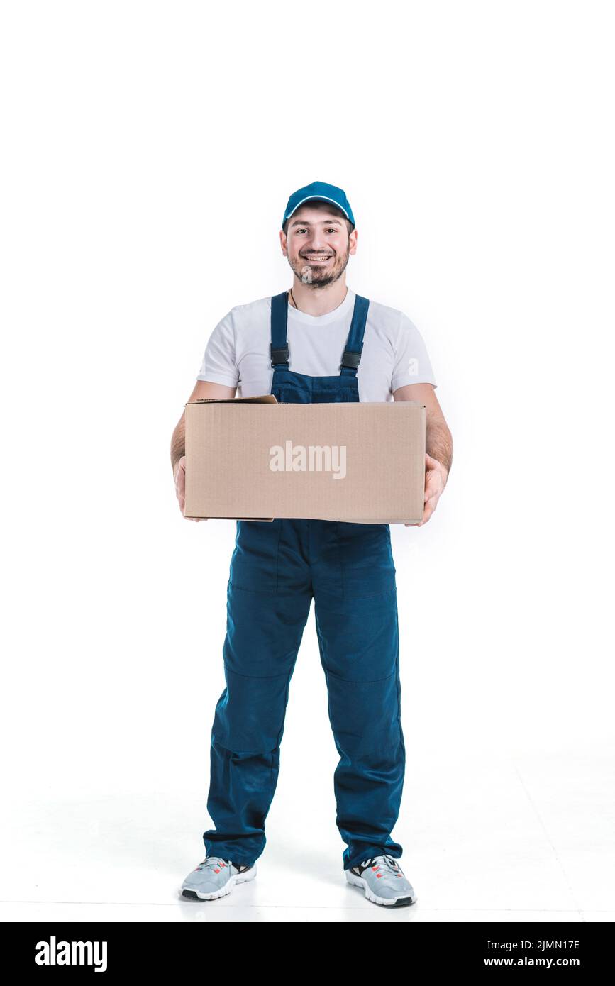 Cheerful deliveryman with parcel Stock Photo