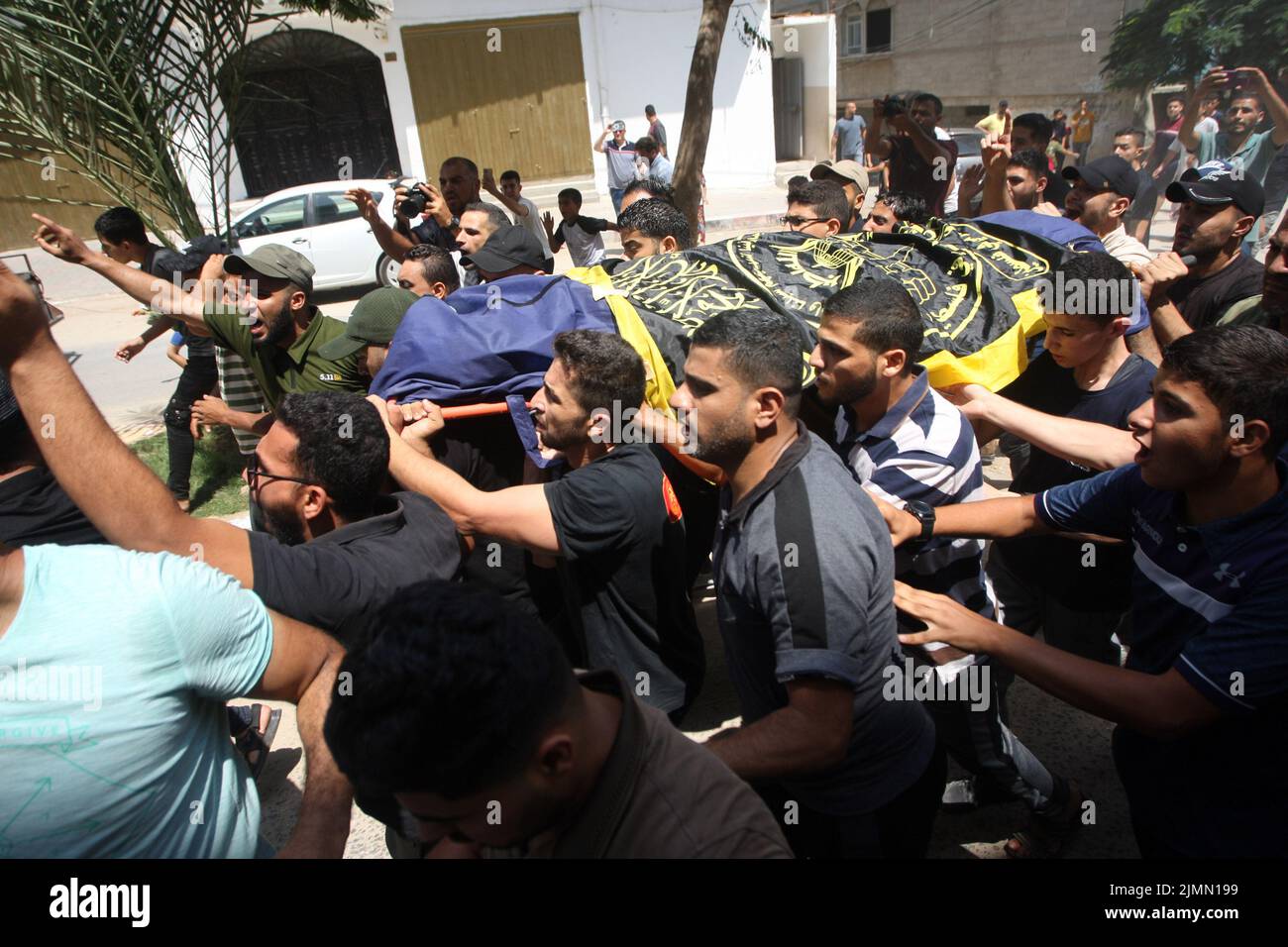 Mourners carry a body during a mass funeral for senior commander of Islamic Jihad militant group Khaled Mansour and other Palestinians, who were killed in Israeli air strikes in Rafah in the southern Gaza Strip, on Sunday on August 7, 2022. Photo by Ismael Mohamad/UPI Stock Photo