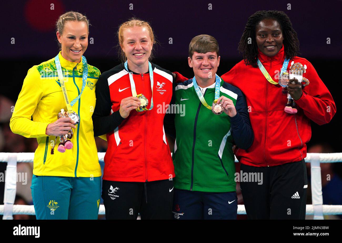 Australia's Kaye Frances Scott, silver, Wales's Rosie Eccles, Gold, Northern Ireland's Eirann Nugent, bronze, and Mozambique's Alcinda Panguane, bronze, after the Women's Light Middle (66-70kg) Final at The NEC on day ten of the 2022 Commonwealth Games in Birmingham. Picture date: Sunday August 7, 2022. Stock Photo