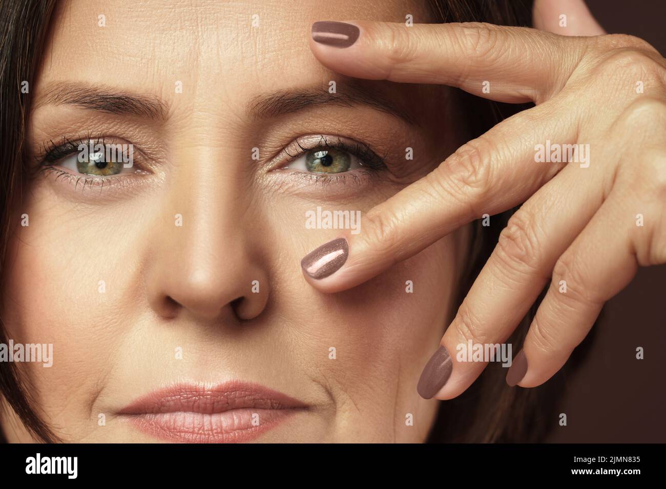 Beautiful middle aged woman with clean wrinkled skin Stock Photo - Alamy
