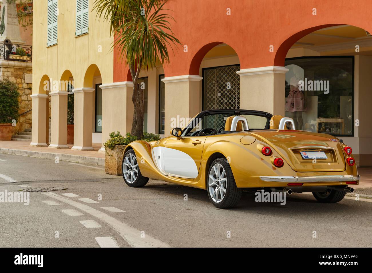 Exclusive vintage car is standing on narrow small streets, replica on