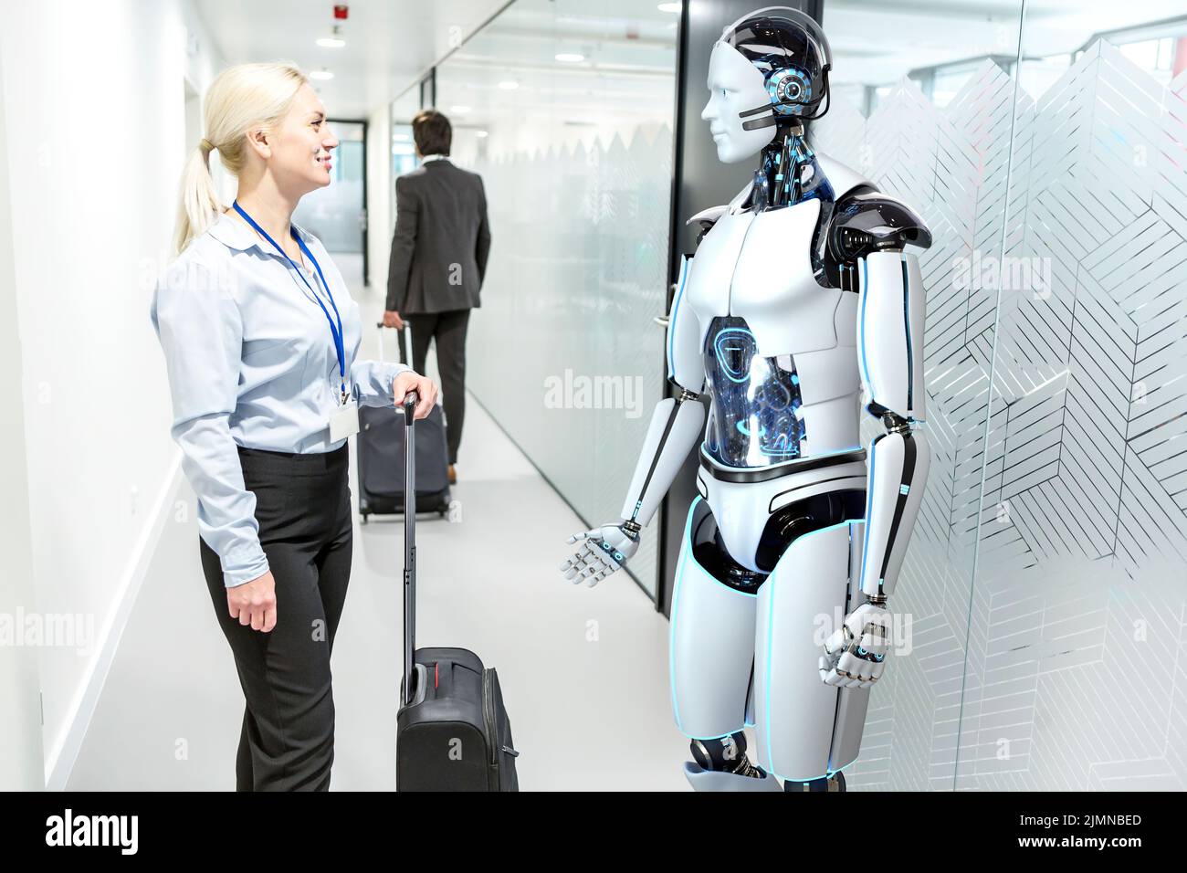Humanoid robot assists company visitors Stock Photo