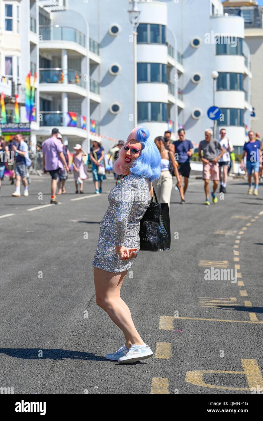 Brighton UK 7th August 2022 - Visitors enjoy the hot sunny weather in brighton during the Pride Festival Weekend celebrations . More hot weather is forecast for parts of the UK over the next week with temperatures expected to go above 30 degrees again : Credit Simon Dack / Alamy Live News Stock Photo