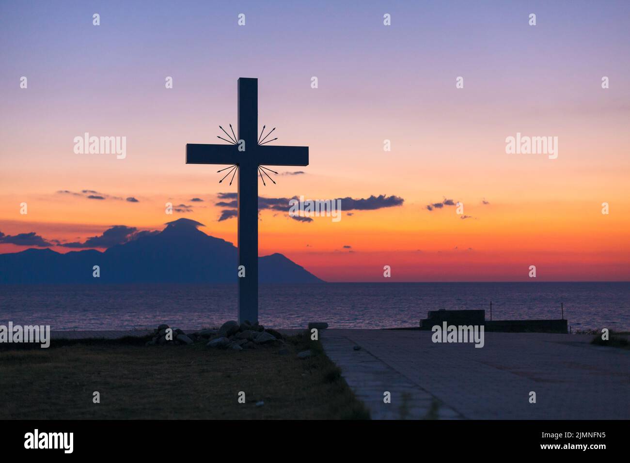 Silhouette of cross and mount Athos, Greece Stock Photo