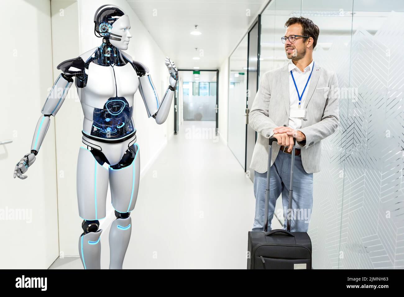 Humanoid robot assists company visitors Stock Photo