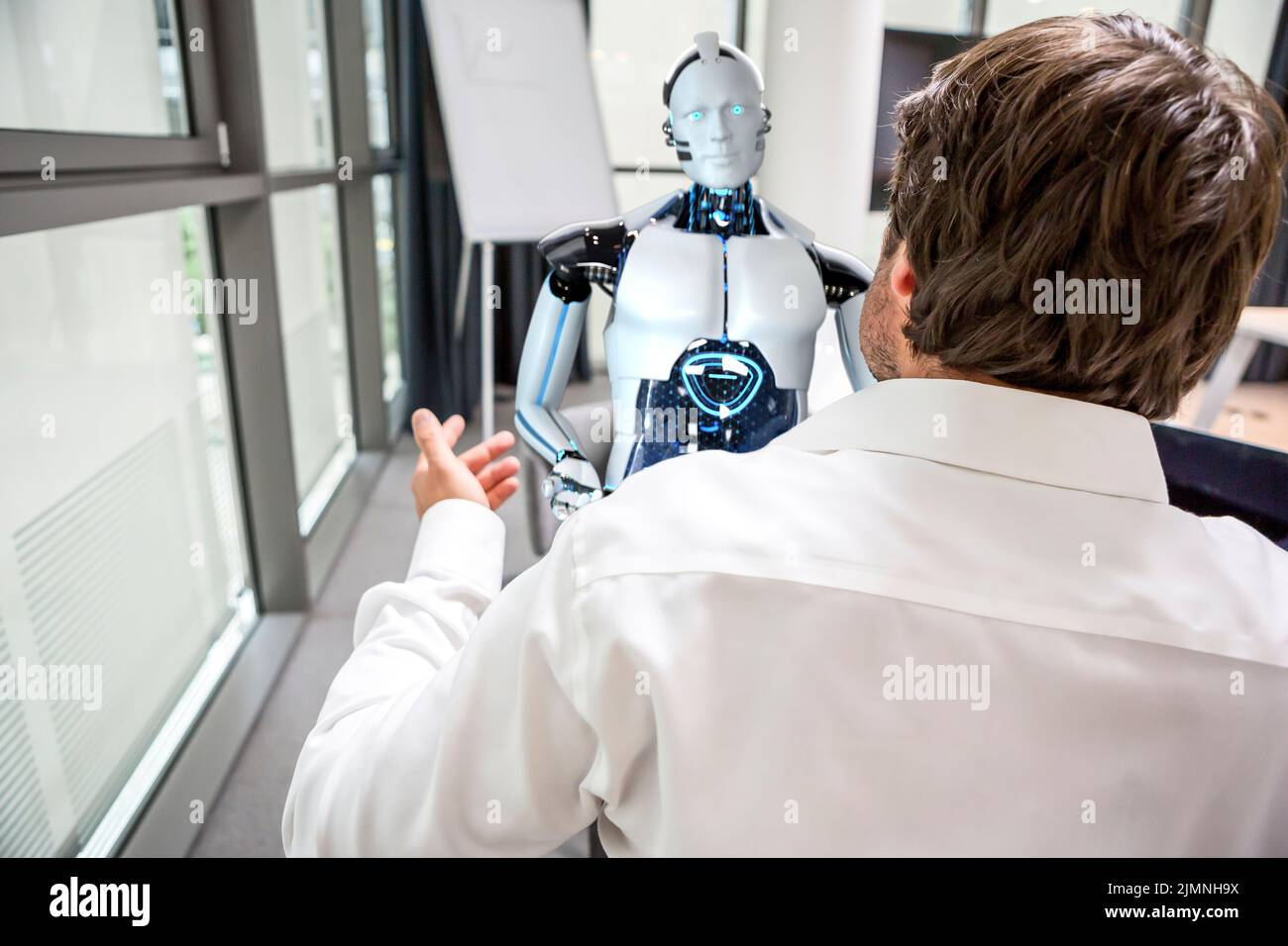 Businessman and humanoid robot solving problems Stock Photo