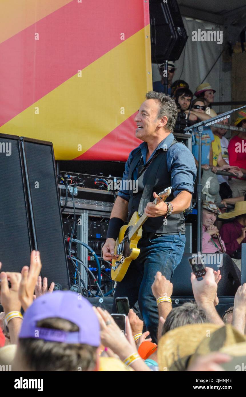 Bruce Springsteen looks out on the crowd and performs on his Telecaster at the New Orleans Jazz and Heritage Festival on April 29, 2012 Stock Photo