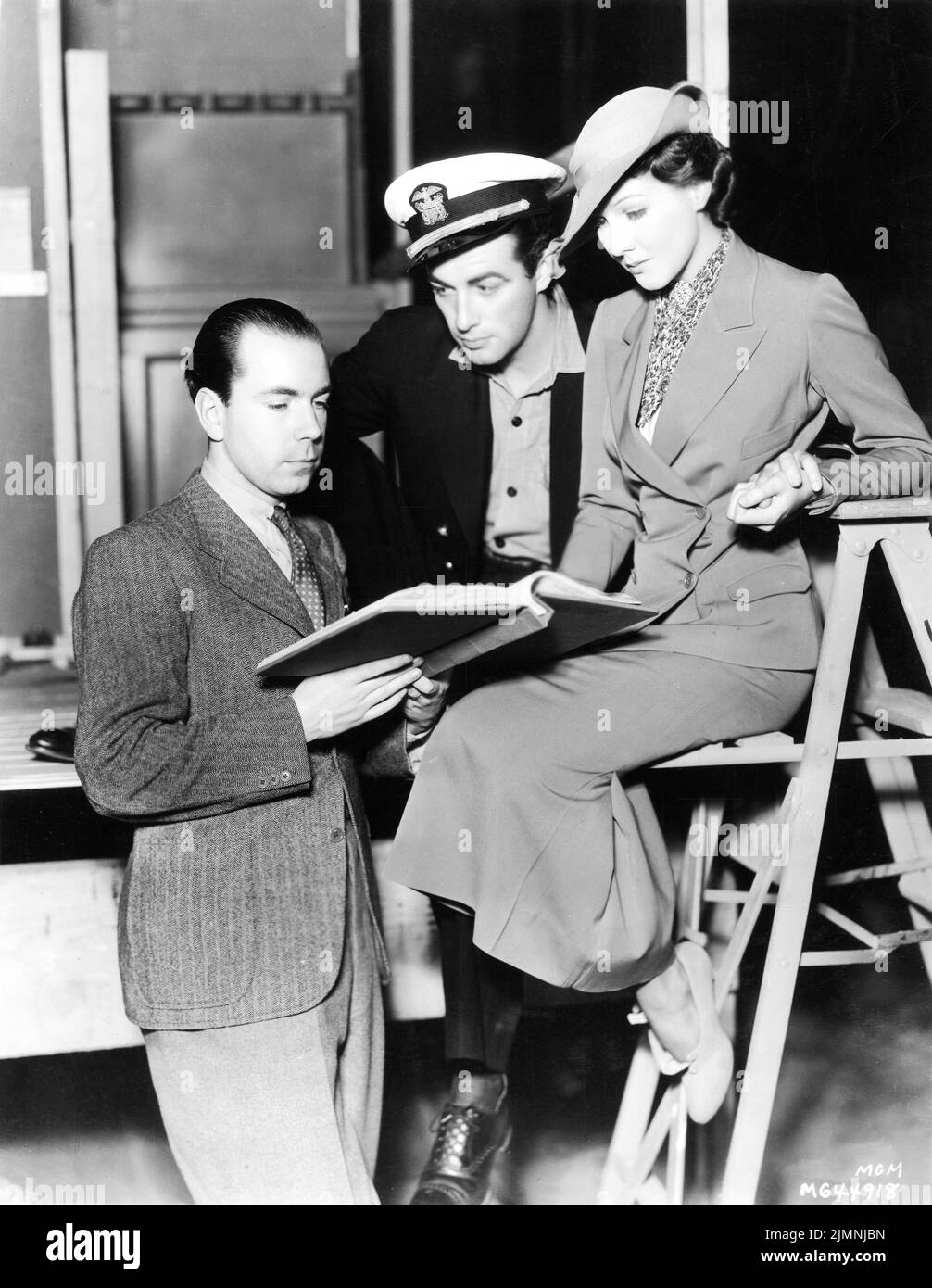 Assistant Director Prince SIGVARD BERNADOTTE, grandson of the King of Sweden, goes over the script with ROBERT TAYLOR and JEAN PARKER on set candid during filming of MURDER IN THE FLEET 1935 director / original story EDWARD SEDGWICK Metro Goldwyn Mayer Stock Photo