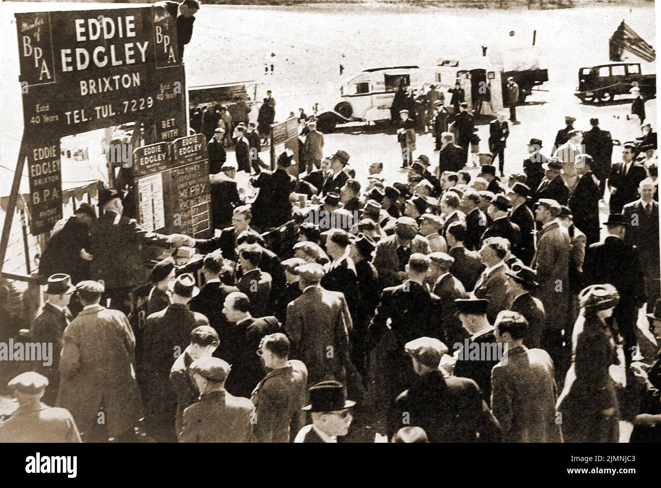 An old photograph of Bookmakers Eddie Edgley of Brixton taking bets at Epsom racecourse.jpg Stock Photo