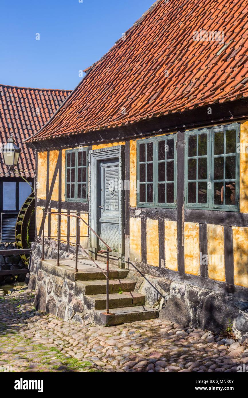 Cobblestoned street with a historic half timbered house in Aarhus, Denmark Stock Photo