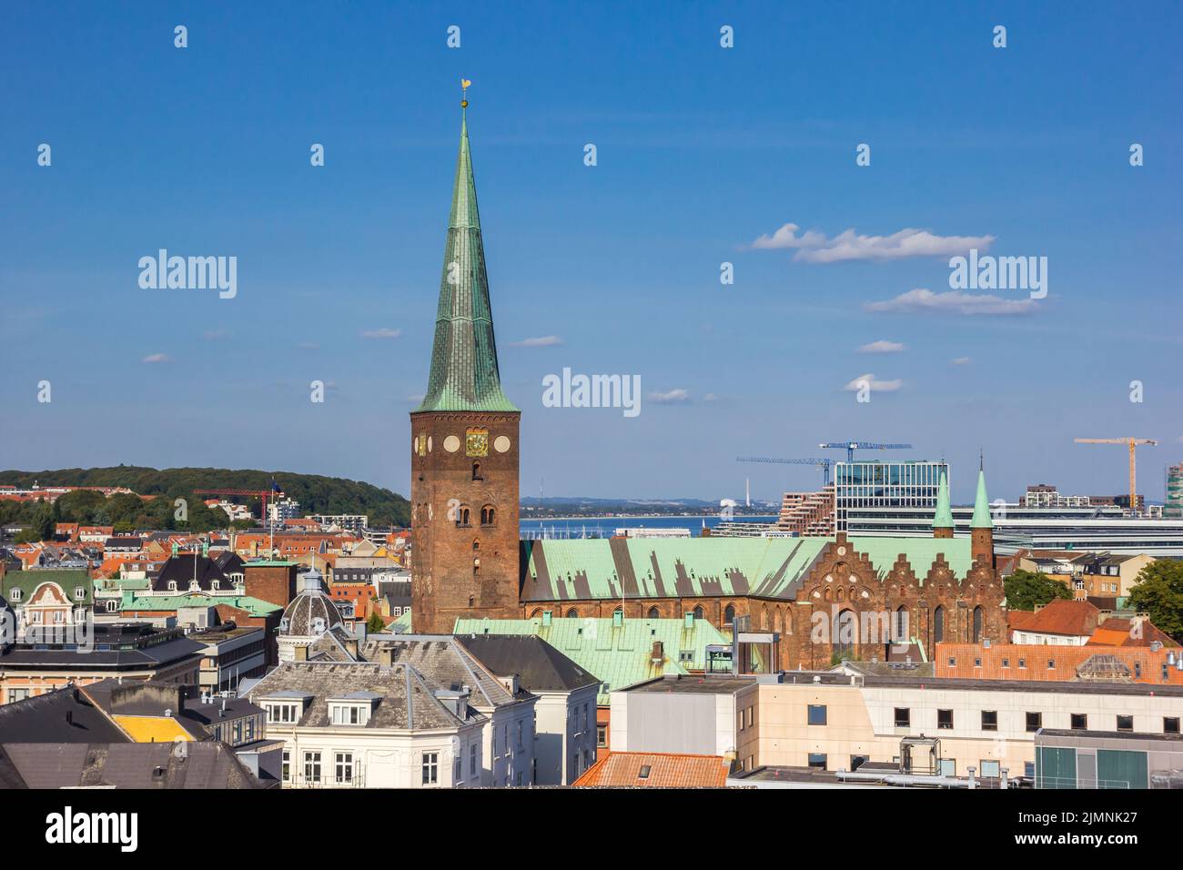 Tower of the historic Domkirke church in the skyline of Aarhus, Denmark Stock Photo