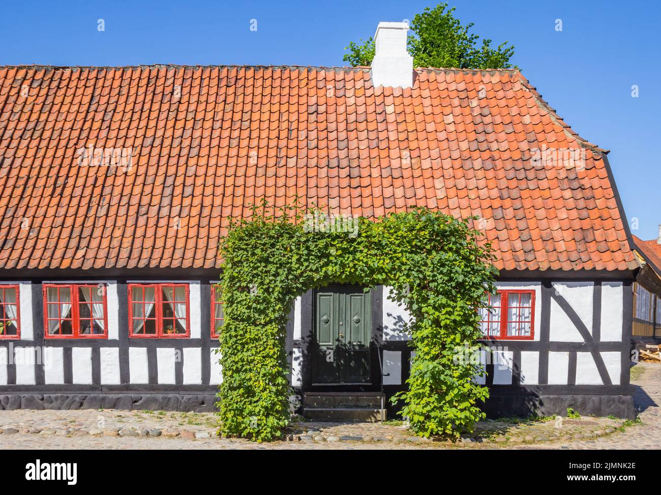 Front facade of a white half timbered house in the historic city of Aarhus, Denmark Stock Photo