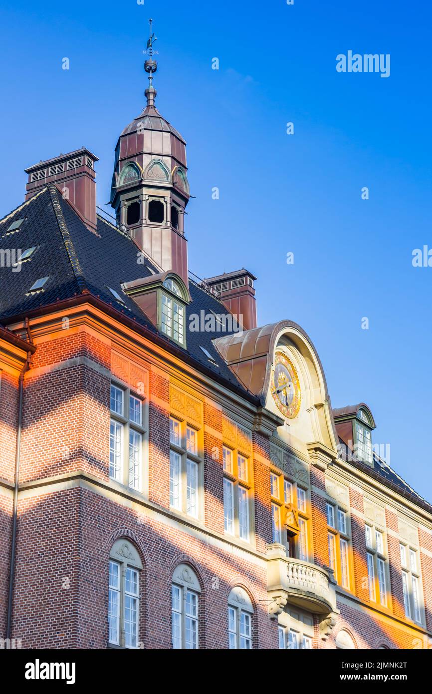 Orange light in the evening on the historic courthouse in Aarhus, Denmark Stock Photo