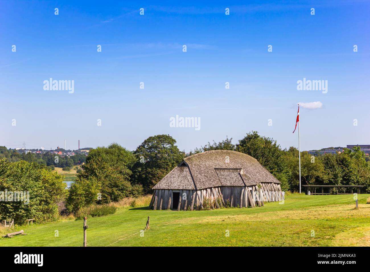 Recontructed Viking longhouse in the rolling landscape of Fyrkat near Hobro, Denmark Stock Photo