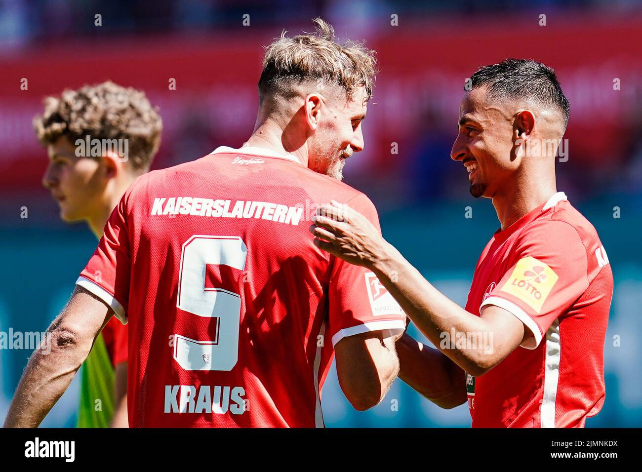07 August 2022, Rhineland-Palatinate, Kaiserslautern: Soccer: 2nd Bundesliga, 1. FC Kaiserslautern - FC St. Pauli, Matchday 3, Fritz-Walter-Stadion. Kaiserslautern's goal scorer Kenny Prince Redondo (r) celebrates the victory with Kaiserslautern's Kevin Kraus. Photo: Uwe Anspach/dpa - IMPORTANT NOTE: In accordance with the requirements of the DFL Deutsche Fußball Liga and the DFB Deutscher Fußball-Bund, it is prohibited to use or have used photographs taken in the stadium and/or of the match in the form of sequence pictures and/or video-like photo series. Stock Photo