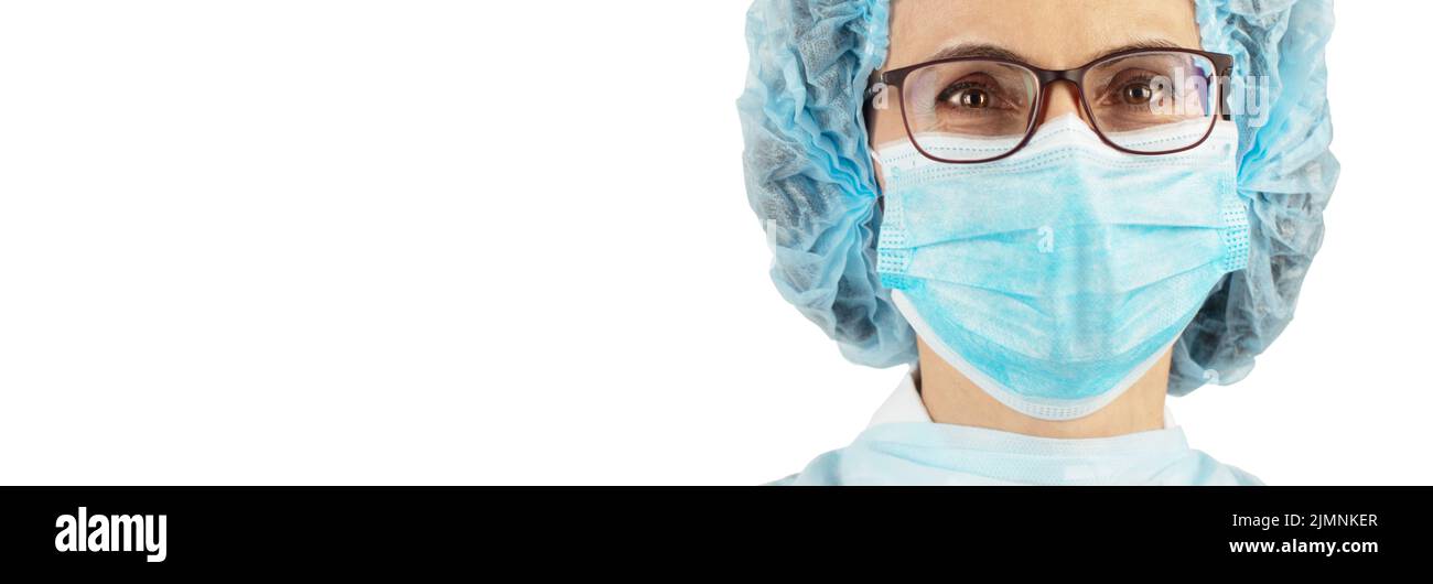 Female caucasian medical worker looking straight ahead in protective mask headshot portrait closeup on white background banner m Stock Photo
