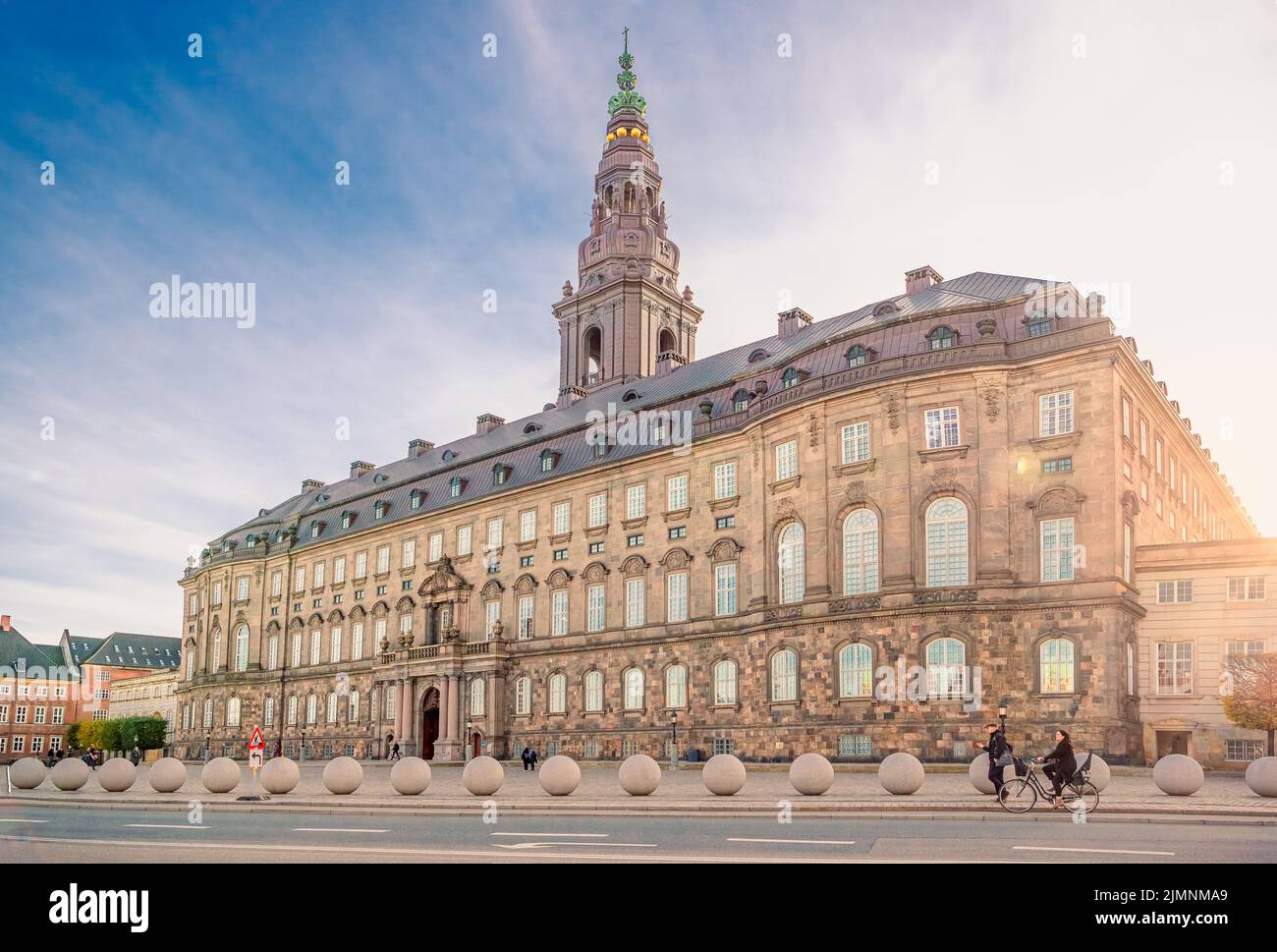 Christiansborg Palace with Christiansborg tower - the seat of the Danish Parliament in the rays of the setting sun. Copenhagen, Stock Photo
