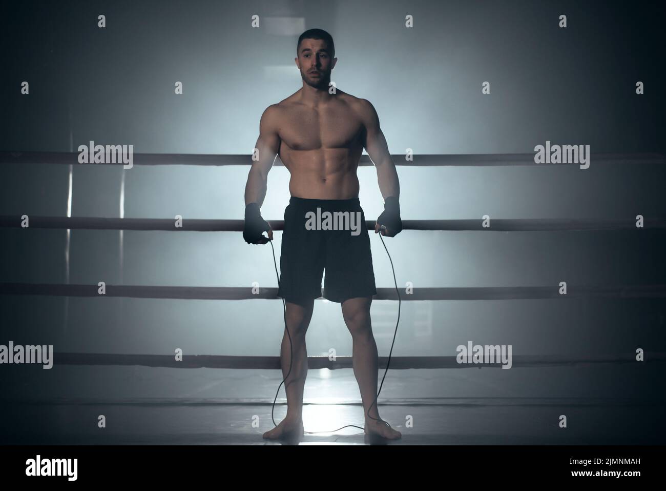 Boxer jumping rope in boxing ring Stock Photo Alamy
