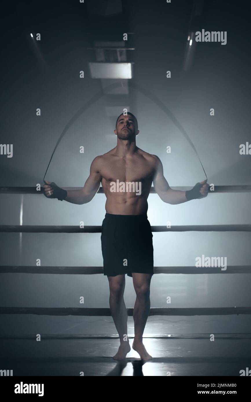 Boxer jumping rope in boxing ring Stock Photo Alamy