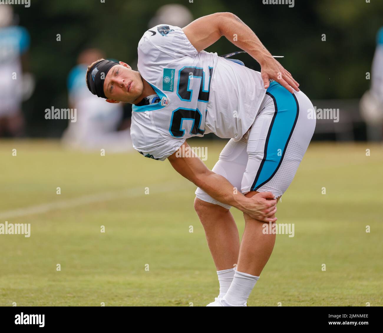 Spartanburg, SC USA;  Running back Christian McCaffrey (22) stretches during Carolina Panthers Training Camp, Saturday, August 5, 2022, at Wofford Col Stock Photo