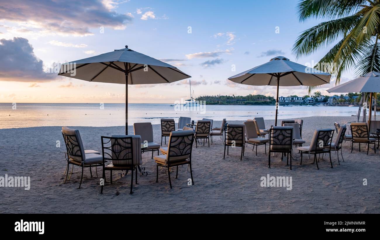Luxury travel, romantic beach getaway holidays for honeymoon couple, tropical vacation in luxurious hotel, beach chairs on the b Stock Photo