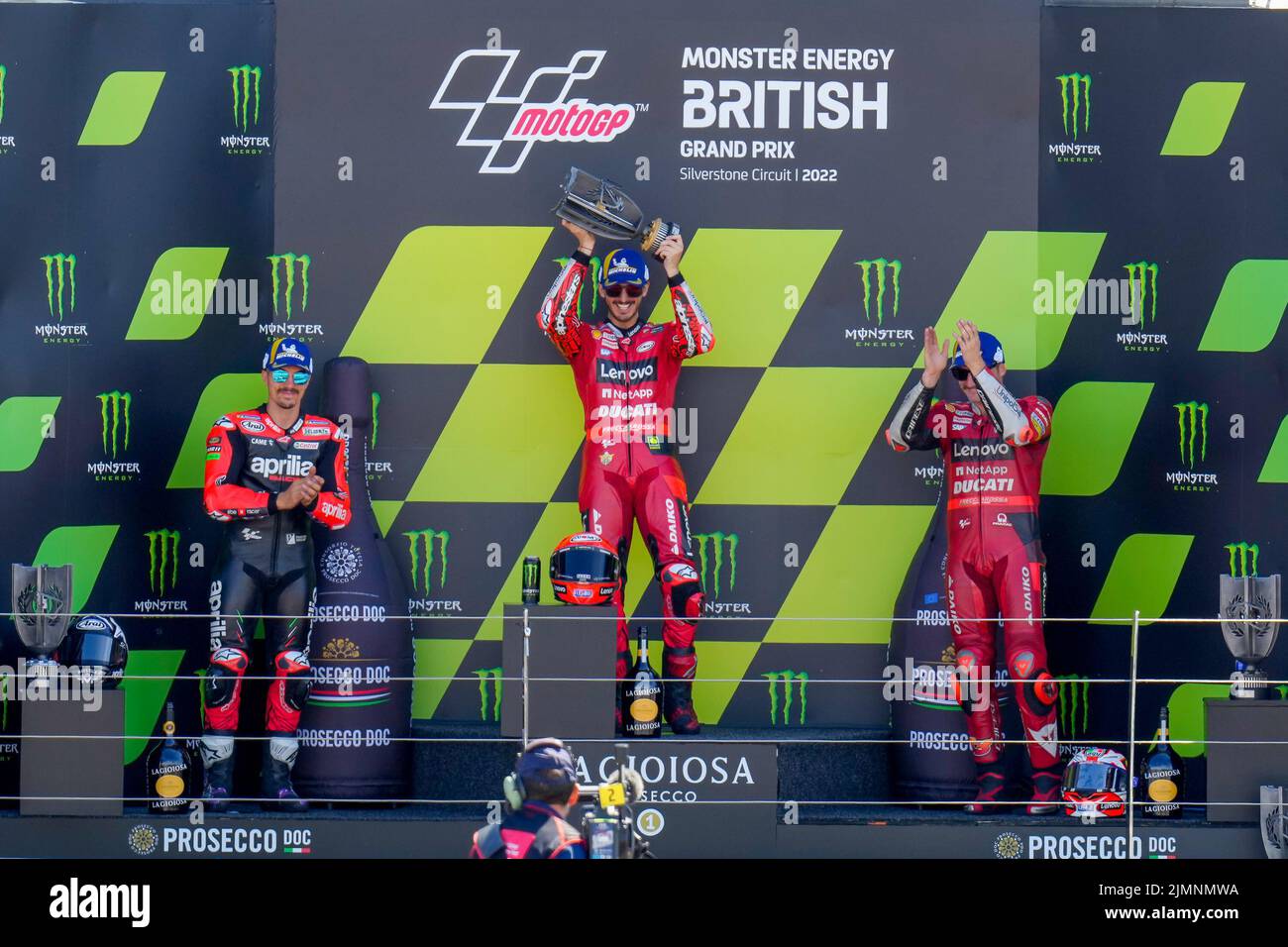 Towcester, UK. 07th Aug, 2022. Francesco BAGNAIA (Italy) of the Ducati Lenova Team (centre) celebrates on the podium with Maverick VINALES (Spain) of the Aprilia Racing Team (left) and Jack MILLER (Australia) of the Ducati Lenova Team (right) after finishing first, second and third respectively in the 2022 Monster Energy Grand Prix Race at Silverstone Circuit, Towcester, England on the 7th August 2022. Photo by David Horn. Credit: PRiME Media Images/Alamy Live News Stock Photo