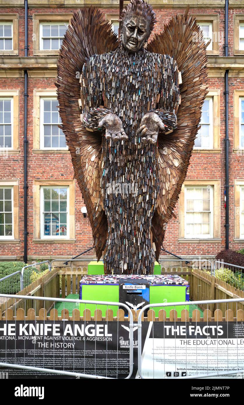 The Knife Angel sculpture by Sculptor Alfie Bradley made from over 100,000 knives handed in to Police combating crime in UK displayed in Kirkleatham R Stock Photo
