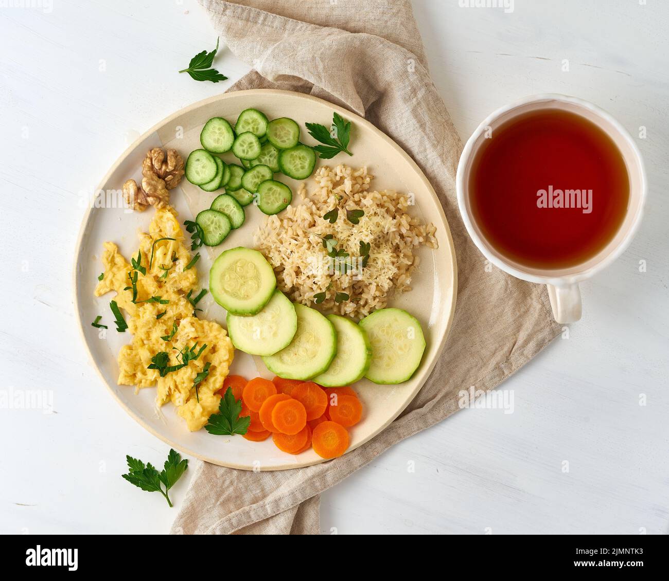 Balanced gluten free food, brown rice zucchini with scramble, dash