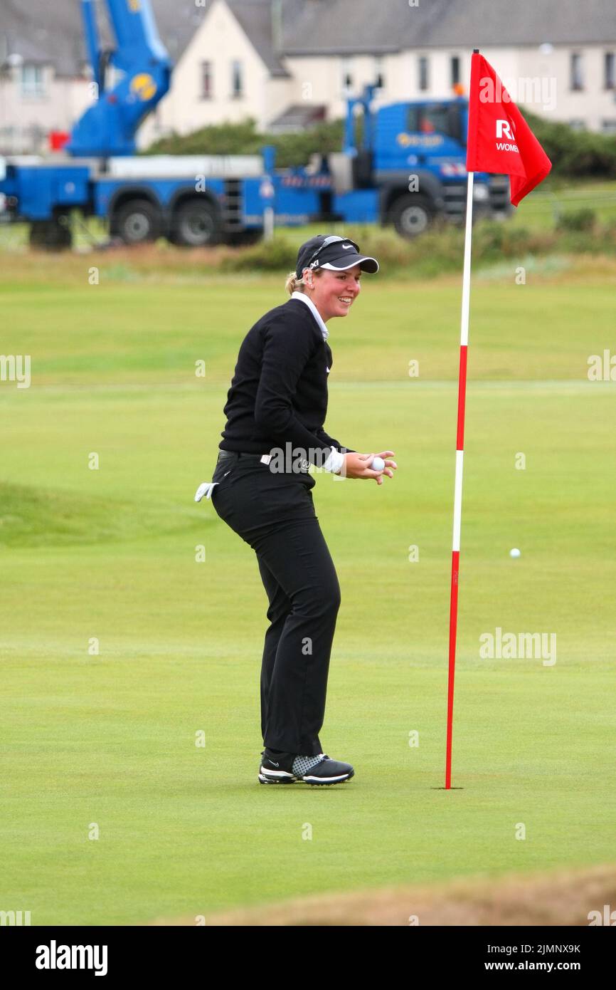 Ashleigh Buhai of South Africa celebrates scoring a hole-in-one on the 16th green during final practice round of 2011 Ricoh Women's British Open held Stock Photo