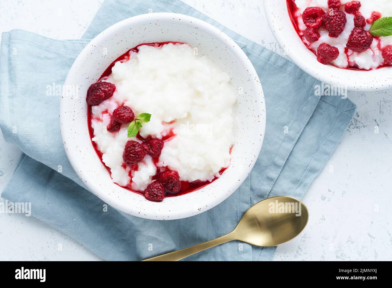 Rice Pudding. Long banner, Vegan Coconut diet breakfast with coconut milk, raspberry Stock Photo