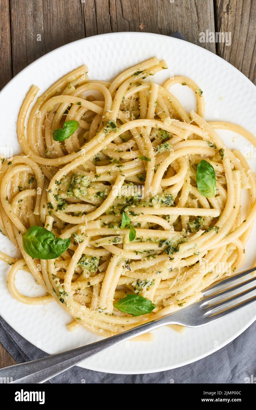 Pesto spaghetti pasta with basil, garlic, pine nuts, olive oil