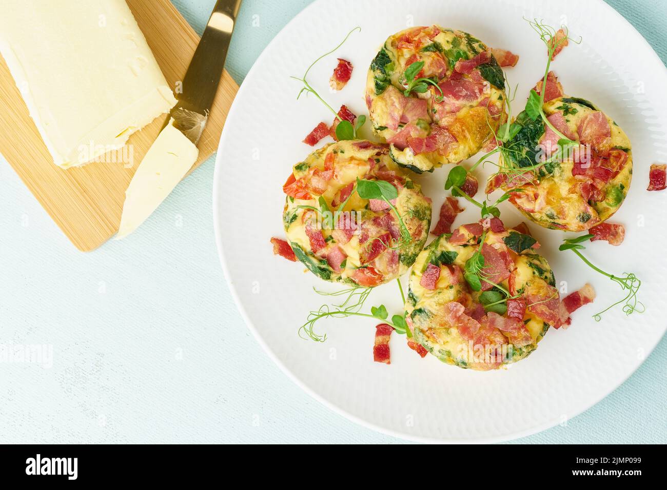 Egg muffin baked with bacon, ketogenic keto diet, pastel modern top view Stock Photo