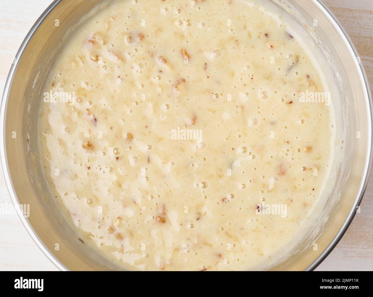 Dough for cake. Step by step recipe. Homemade Banana bread. Top view, a white table. Stock Photo