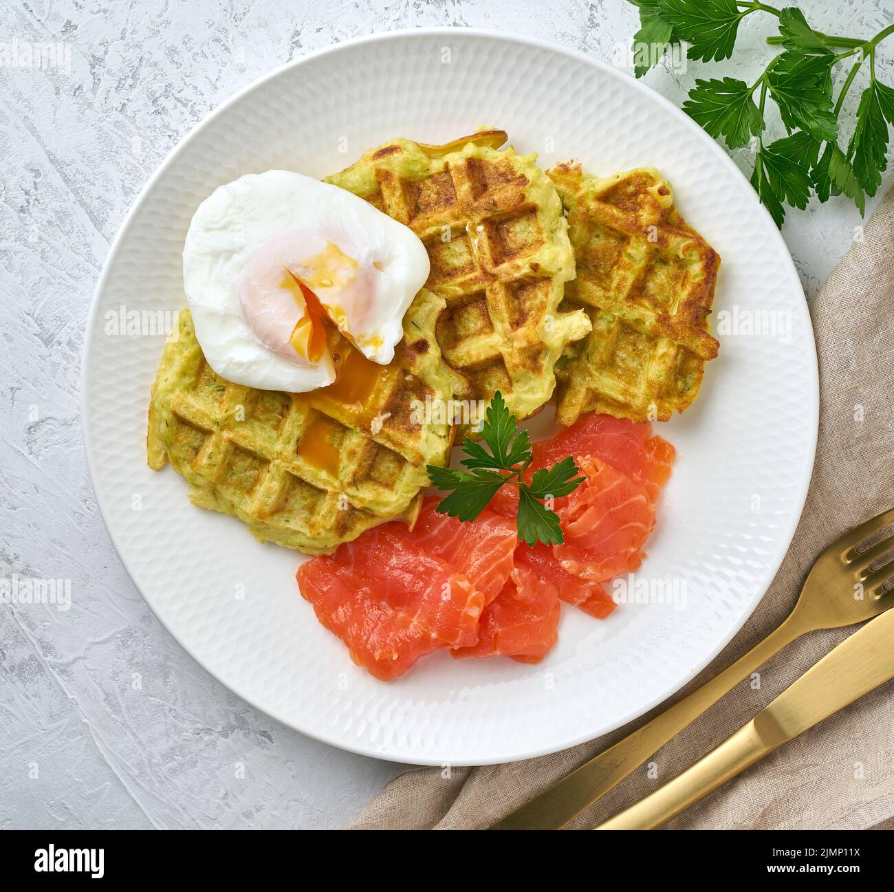 Zucchini waffles with salmon and benedict egg, fodmap diet top view