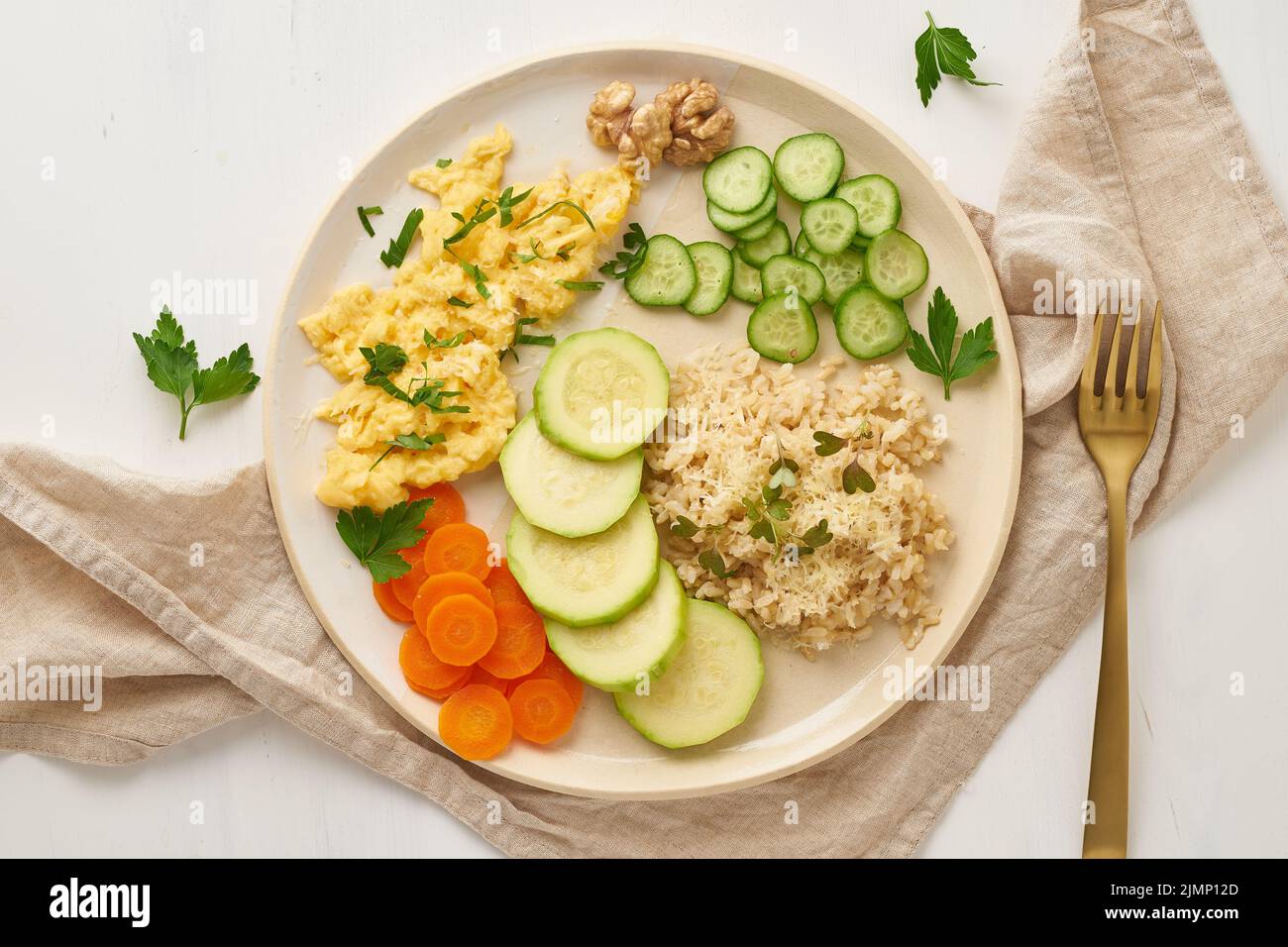 Balanced gluten free food, brown rice zucchini with scramble, dash