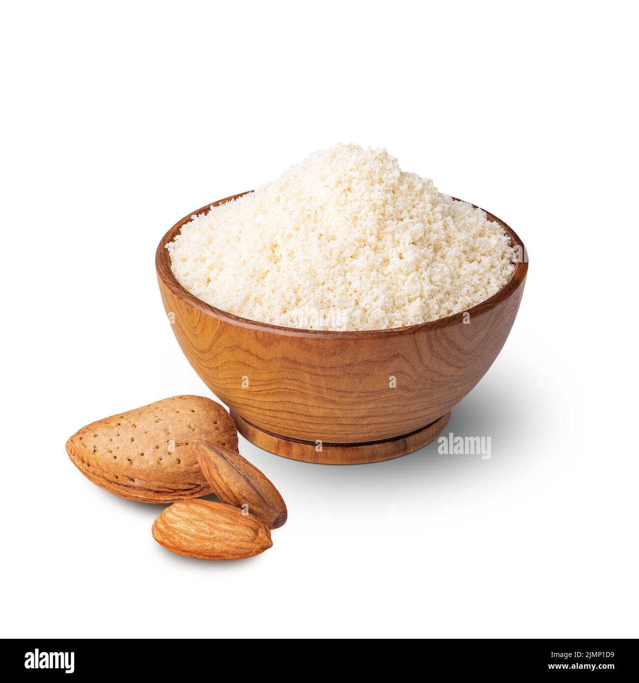 Wooden bowl full of almond flour isolated on white. Deep focus Stock Photo