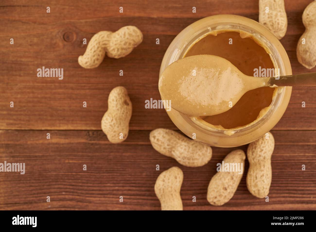 An Open Jar Of Peanut Butter With Spoon Stock Photo, Picture and Royalty  Free Image. Image 13094043.