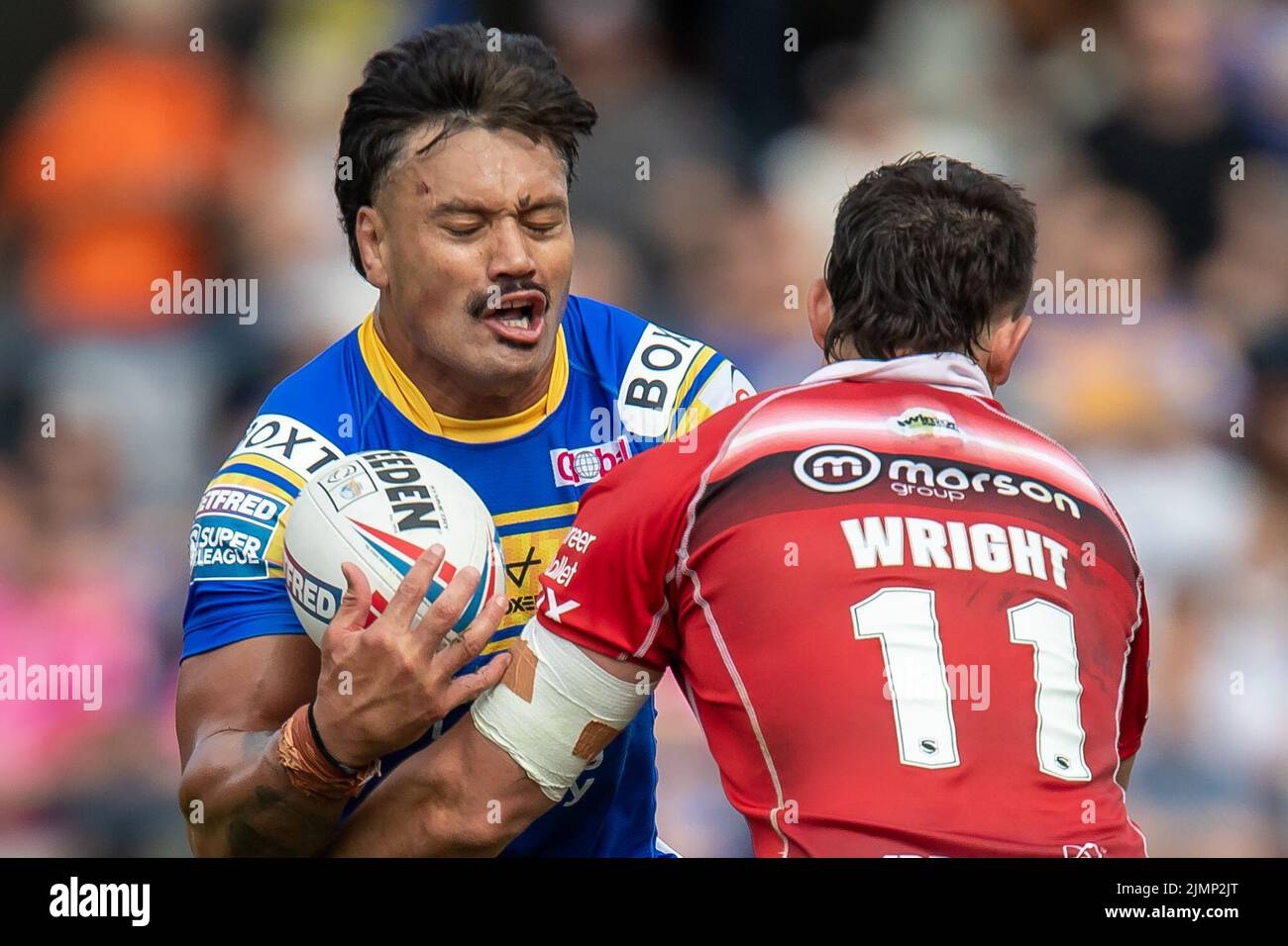 Zane Tetevano #13 of Leeds Rhinos is tackled by Shane Wright #11 of Salford Red Devils  in Leeds, United Kingdom on 8/7/2022. (Photo by James Heaton/News Images/Sipa USA) Stock Photo