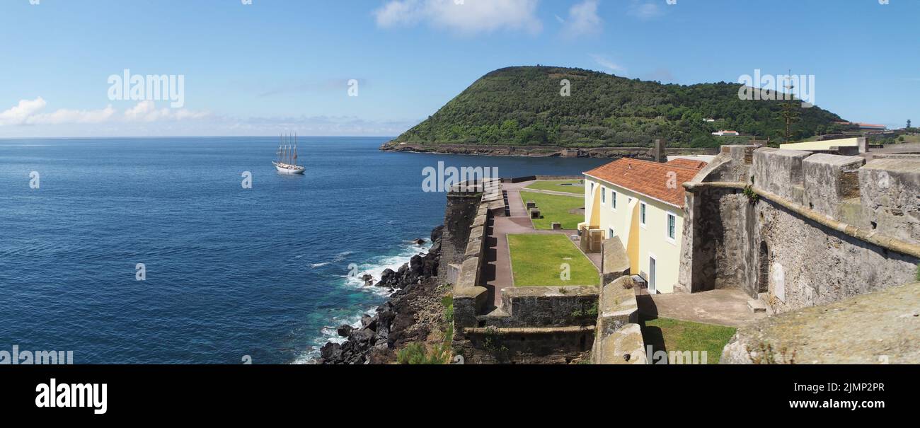 Oceanview from the Fort of Sao Sebastiao, with partial view of the Fort, with Mount Brazil in the background, Angra do Heroismo, Terceira, Portugal Stock Photo