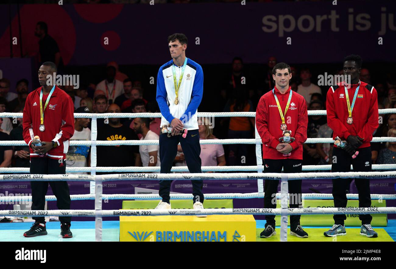 Mauritius' Louis Richard Colin, silver, Scotland's Reese Lynch, gold, Canada's Wyatt Sanford, bronze and Ghana's Abdul Wahib Omar, bronze, after the Men's Light Welter (60-63.5kg) Final at The NEC on day ten of the 2022 Commonwealth Games in Birmingham. Picture date: Sunday August 7, 2022. Stock Photo