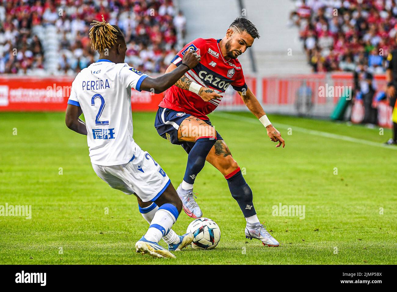 LILLE, FRANCE - AUGUST 7: Brayann Pereira of Auxerre, Remy Cabella of Lille during the French Ligue 1 match between Lille and Auxerre at Stade Pierre Mauroy on August 7, 2022 in Lille, France (Photo by Matthieu Mirville/Orange Pictures) Stock Photo