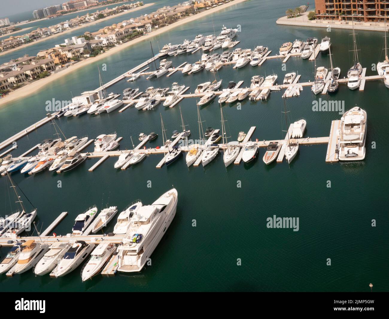 Yachts moored in Dubai Marina an affluent residential neighborhood in  Dubai UAE, United Arab Emirates, Stock Photo