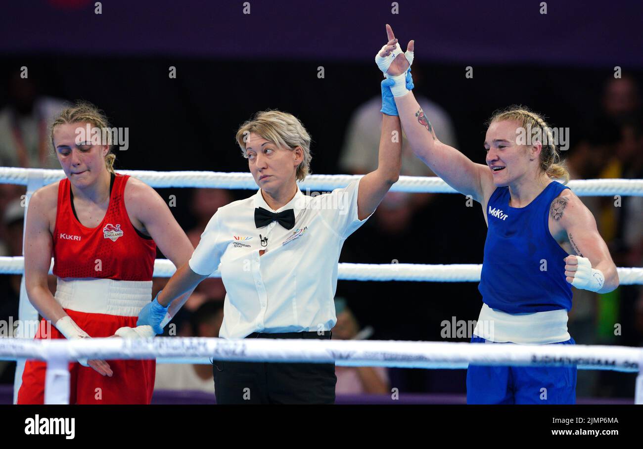 Northern Ireland's Amy Sara Broadhurst (blue) celebrates victory against England's Gemma Paige Richardson in the Women's Light (57-60kg) Fina at The NEC on day ten of the 2022 Commonwealth Games in Birmingham. Picture date: Sunday August 7, 2022. Stock Photo