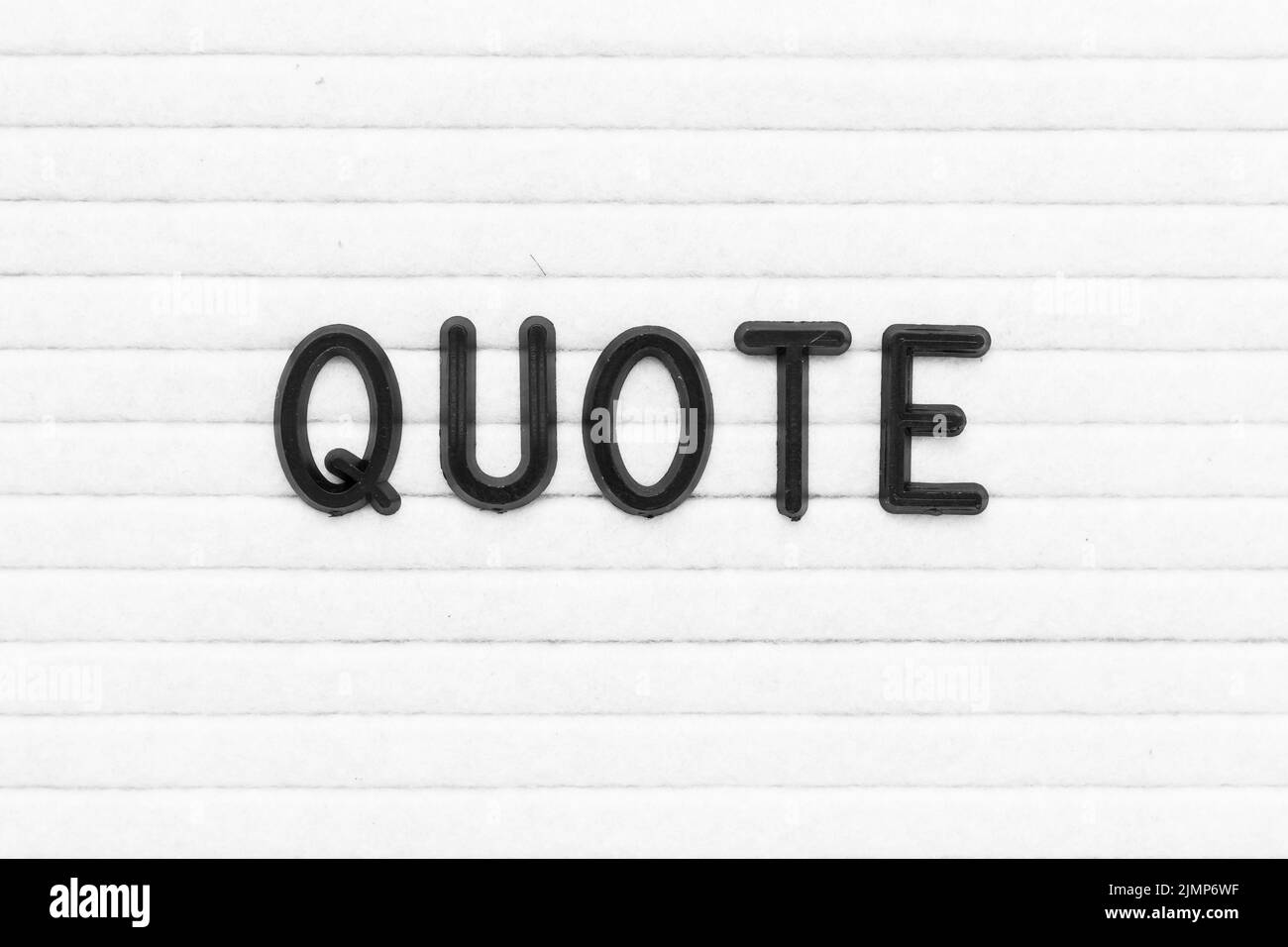 Black color letter in word quote on white felt board background Stock ...