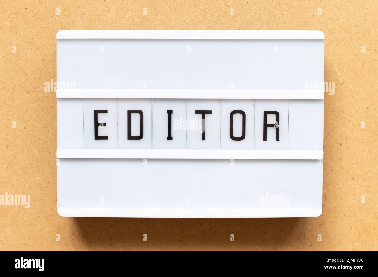 Lightbox with word editor on wood background Stock Photo