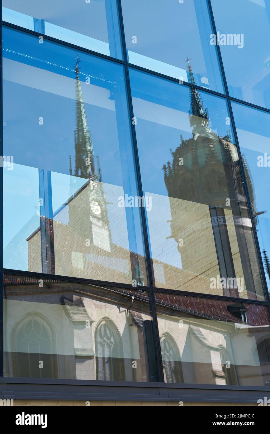 Reflection of the castle church Schlosskirche in Wittenberg in Germany in the glass of a window Stock Photo
