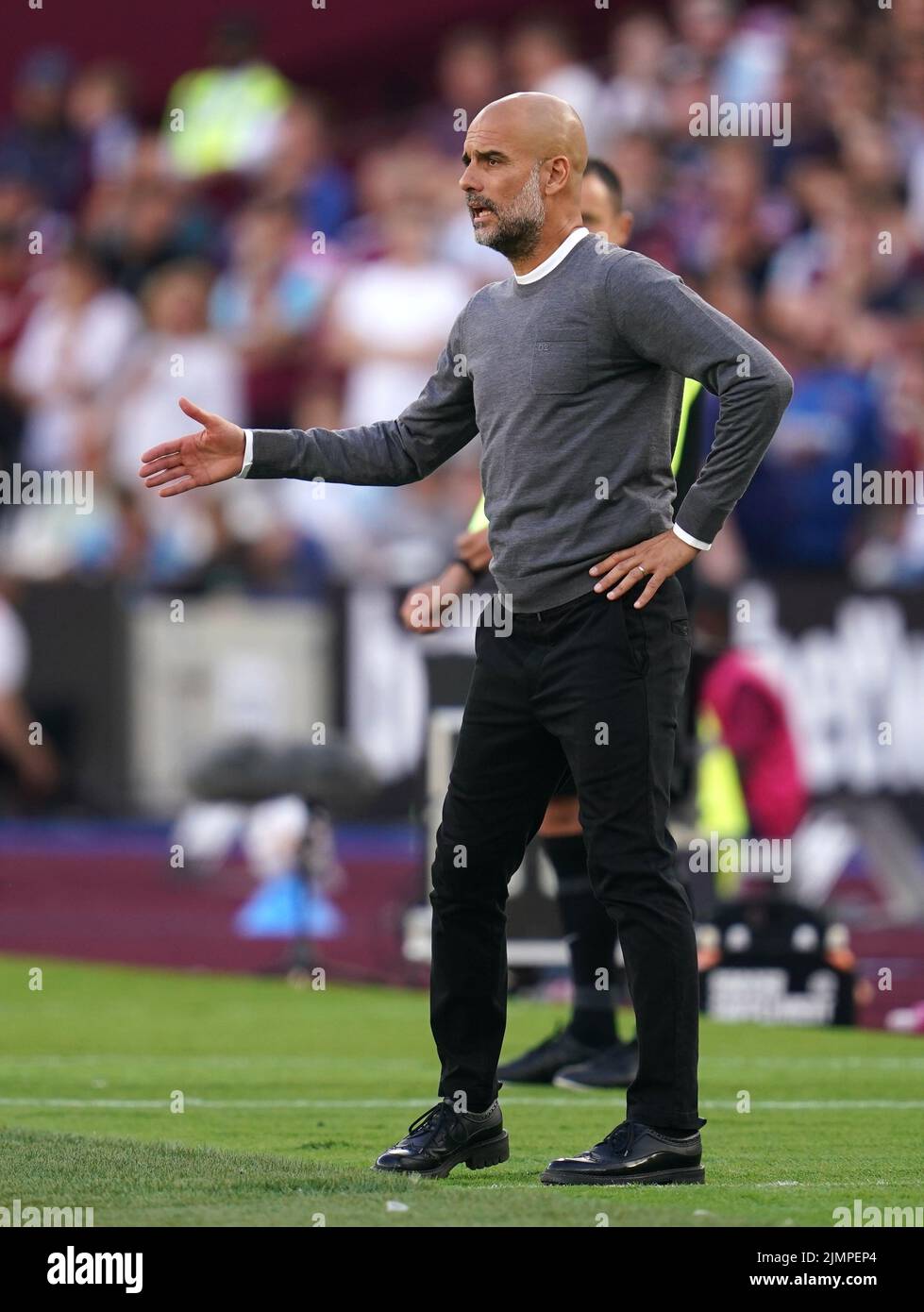 Manchester City manager Pep Guardiola on the touchline during the Premier League match at London Stadium. Picture date: Sunday August 7, 2022. Stock Photo