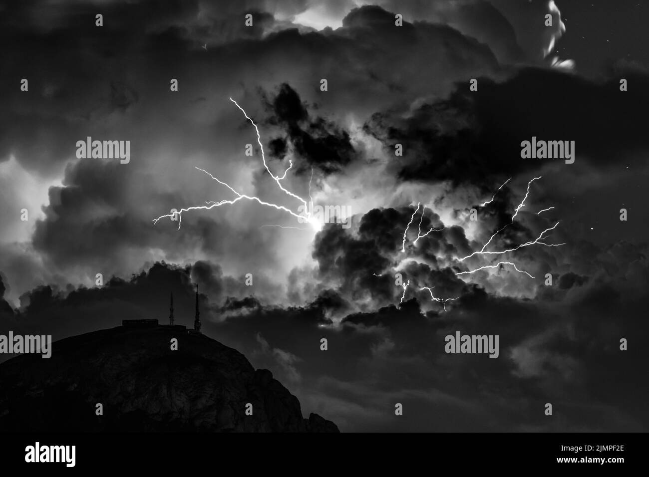 Huge lightning bolt during nightly thunderstorm in the Dolomites. Italy, Dolomites. Stock Photo